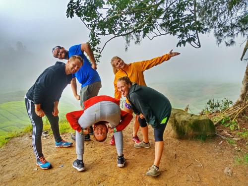 a group of people on the side of a mountain at A3A Oastel CoLiving in Tanah Rata