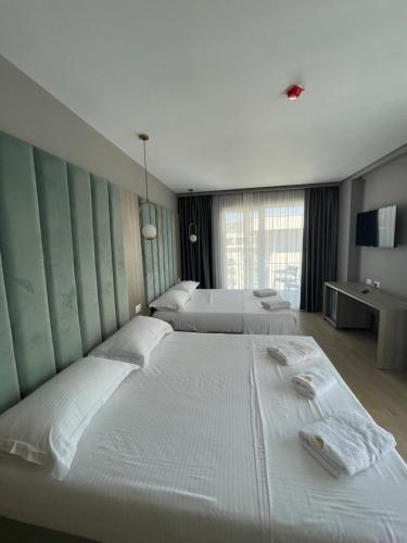 A bed or beds in a room at SACA HOTEL