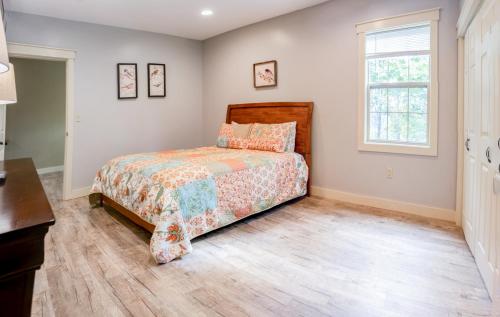 a bedroom with a bed and a window at House close to Acadia National Park in Ellsworth