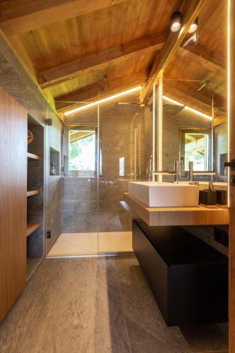 a bathroom with a sink and a shower at Megève - Chalet Miage in Demi-Quartier