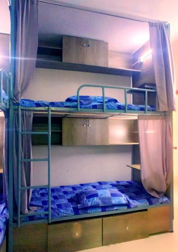 a couple of bunk beds in a room at Smart Hostel in Dhaka