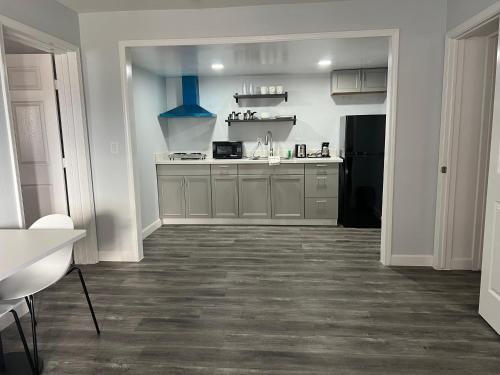 a large kitchen with a counter top and a kitchen at Studio 6 Tulsa OK Central in Tulsa