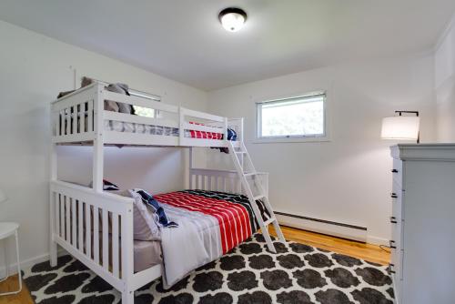 a bedroom with a bunk bed and a ladder at Cozy Retreat in Spokane Valley with Fireplace in Spokane Valley