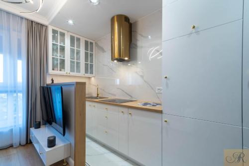 Η κουζίνα ή μικρή κουζίνα στο Apartament Rosa Stacja Mińsk