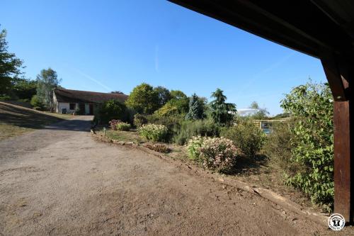 a dirt road in front of a house at Tri-O-Bois in Thianges
