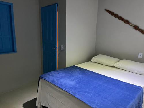 Ένα ή περισσότερα κρεβάτια σε δωμάτιο στο Pousada Crocodilo Caraíva