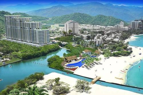 Espectacular Apartamento con Vista al Mar y Playa Privada, Samaria Club de playa Piso 13, 3 alcobas, 2 baños, 6 personas