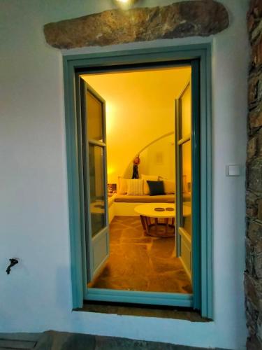a doorway into a room with a living room at Amorgos Elegant Houses, 6 Villas in Amorgos
