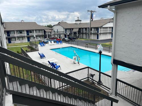 an image of a swimming pool at a apartment complex at Studio 6 Tulsa OK Central in Tulsa