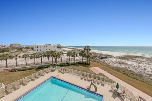 an overhead view of a swimming pool and the beach at Destin on the Gulf 404 - Amazing Views just Steps away from the Beach in Destin