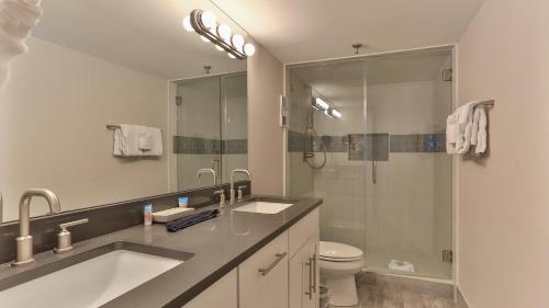 a bathroom with a sink and a shower and a toilet at Destin on the Gulf 604 - Updated Gulf Front sixth floor condo in Destin