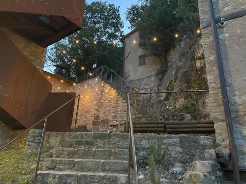 a set of stairs leading up to a building at Borgo dei Sassi di Roccamalatina - Room and Breakfast in Rocca Malatina