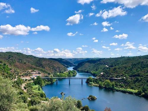 a view of a river with a bridge over it at A Casa do Maltês in Belver