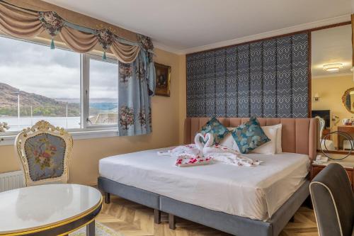 Postel nebo postele na pokoji v ubytování Muthu Fort William Hotel