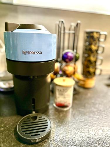 a coffee maker sitting on a kitchen counter at Zen.Modern.Hip “Studio 501” Beach,Scuba,Downtown in West Palm Beach