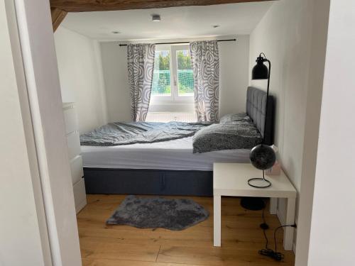 a small bedroom with a bed and a window at HomeSweetHome#Bingen in Bingen am Rhein