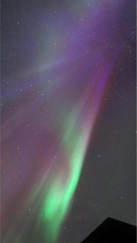 an image of the northern lights in the sky at Brekkukot Cottages, Blönduós in Blönduós