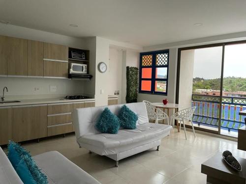 Posezení v ubytování Apartamentos San Jose vistal al lago, cerca del parque. Guatape.