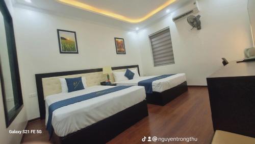 Postel nebo postele na pokoji v ubytování Sao Việt HTH Hotel
