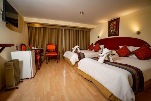 Voodi või voodid majutusasutuse Hotel Agustos Cusco toas