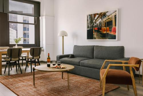 a living room with a couch and a table at Sonder Gabriel Richard in Detroit