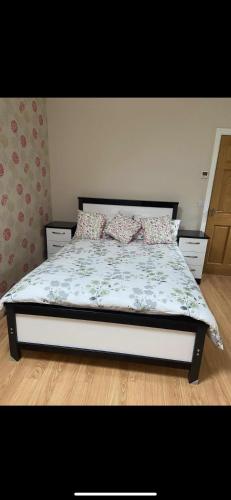 a bedroom with a bed with pillows on it at Glenwood house in Walterstown