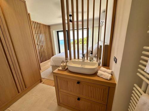 a bathroom with a sink and a mirror at Suite de luxe avec vue mer in Sainte-Maxime