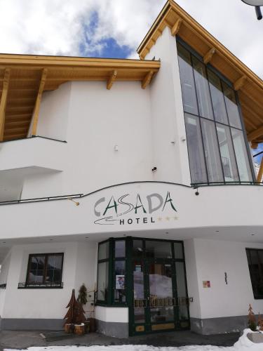 a building with the asada hotel sign on it at Ferienwohnung CASADA im Hotel Casada in Galtür