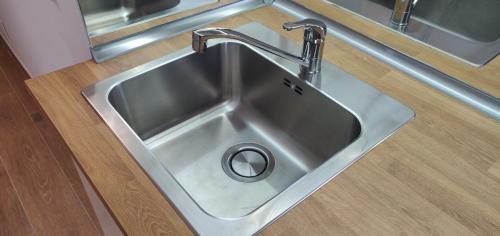 a stainless steel sink with a faucet in a kitchen at Estudio Paradise View - Playa Paraíso Tenerife in Adeje