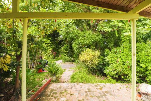 a garden with a pavilion and a walk way at La Casa de Vida Natural in Rio Grande
