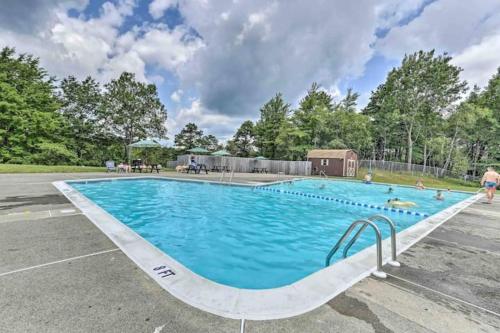 a large swimming pool in a parking lot at PURE Enjoyment HOME with Game Room, Hot tub, Fire Pit in Long Pond