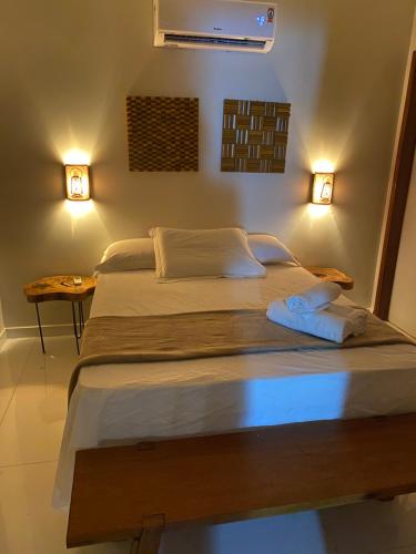 En eller flere senge i et værelse på Pousada Casa Dunas