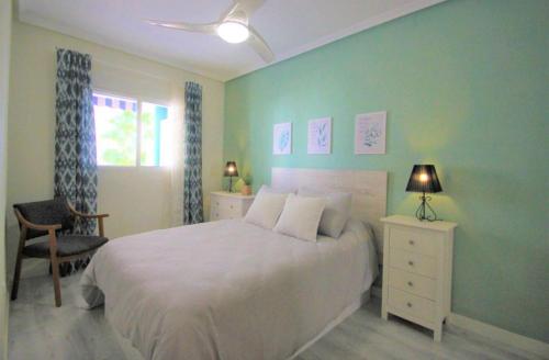 Giường trong phòng chung tại Apartamento Arenales del sol