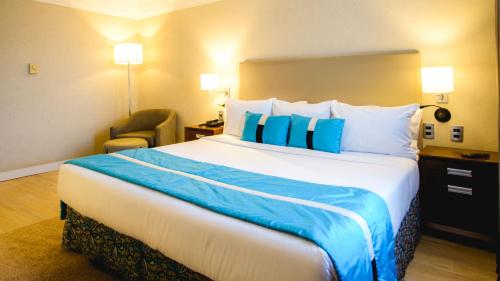 Postel nebo postele na pokoji v ubytování Radisson Alphaville