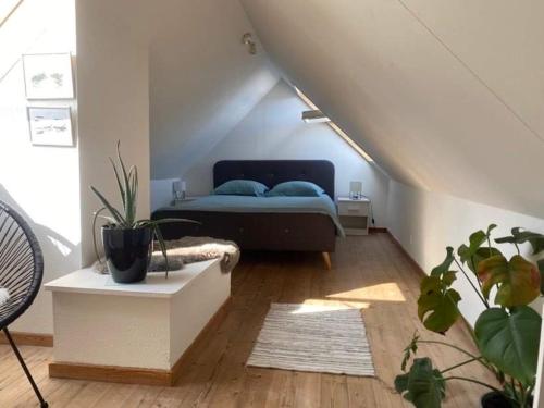 a bedroom with a bed in a attic at Christina in Aalborg