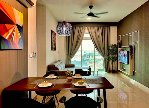a living room with a table and a couch at Aesthetic Home Twin Galaxy -2BR- Free Shuttle Bus by Cowidea in Johor Bahru