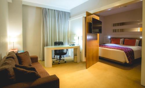 Ένα ή περισσότερα κρεβάτια σε δωμάτιο στο Quality Suites Alphaville
