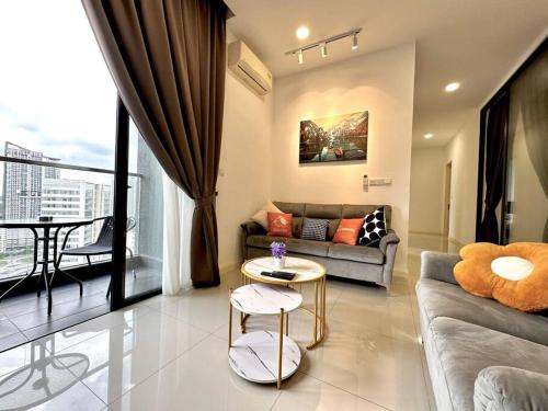 a living room with a couch and a table at Near Legoland - Spacious Home (4BR3B) #Cowidéa in Nusajaya