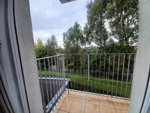 a view of a fence from a balcony at Przytulny Apartament w Gnieźnie in Gniezno