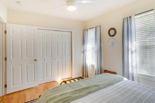a bedroom with a bed and a white door at Lake Wales Vacation Rental with Screened-In Porch! in Lake Wales
