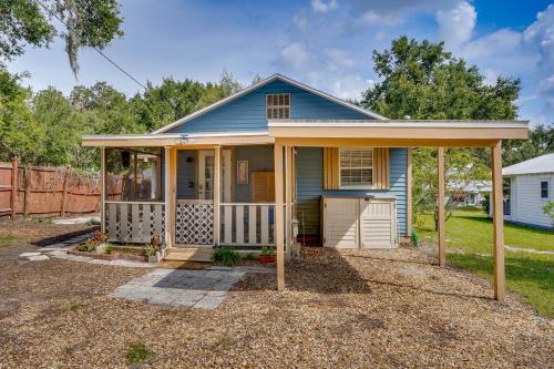 a small blue house with a porch at Lake Wales Vacation Rental with Screened-In Porch! in Lake Wales