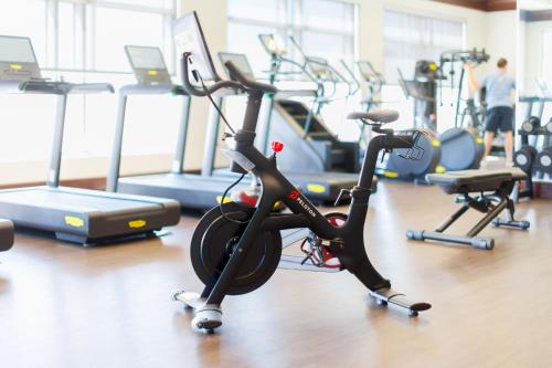 a gym with several treadmills and exercise bikes at Renaissance Birmingham Ross Bridge Golf Resort & Spa in Hoover