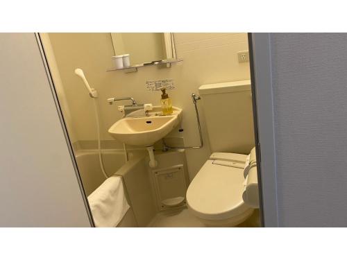 a small bathroom with a toilet and a sink at A&Bee HOTEL - Vacation STAY 35415v in Oita