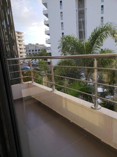 a balcony of a building with a view of a city at Convenient Studio Apt Near Airport, Beaches & Food in Cupecoy