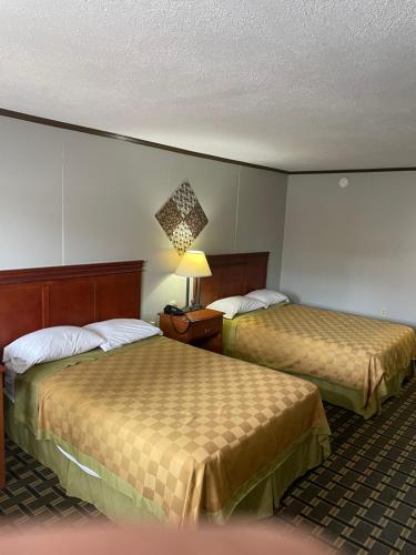 Ένα ή περισσότερα κρεβάτια σε δωμάτιο στο Bedford Inn