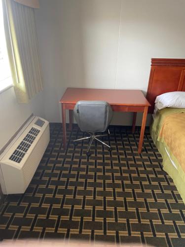 Ένα ή περισσότερα κρεβάτια σε δωμάτιο στο Bedford Inn