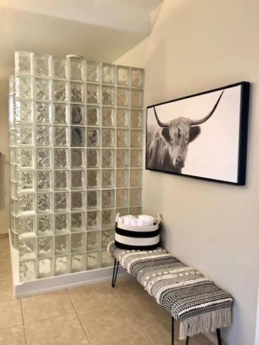 a room with a wall with a picture of a cow at ULTIMATE Mountain Escape with Pool & Hot Tub & Firepit in Sedona