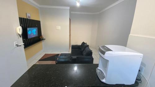 Μια τηλεόραση ή/και κέντρο ψυχαγωγίας στο Apartamento Daia Prox Caoa