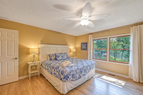 a bedroom with a bed and a ceiling fan at No Wake Zone in Glenora