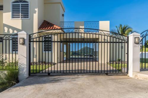 a gate in front of a house at Casa Cielo in Rincon